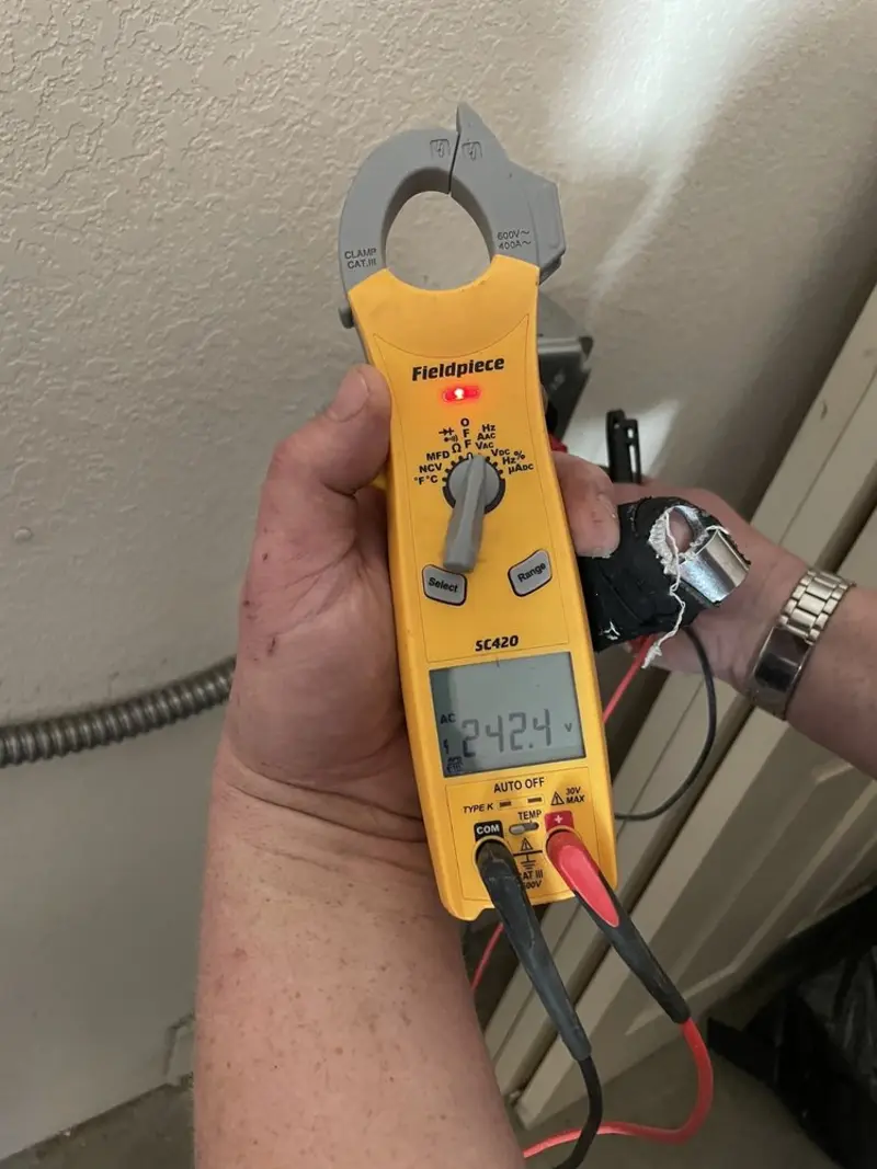 Voltage testing with clamp meter during Recessed Lighting Installation in Lake San Marcos